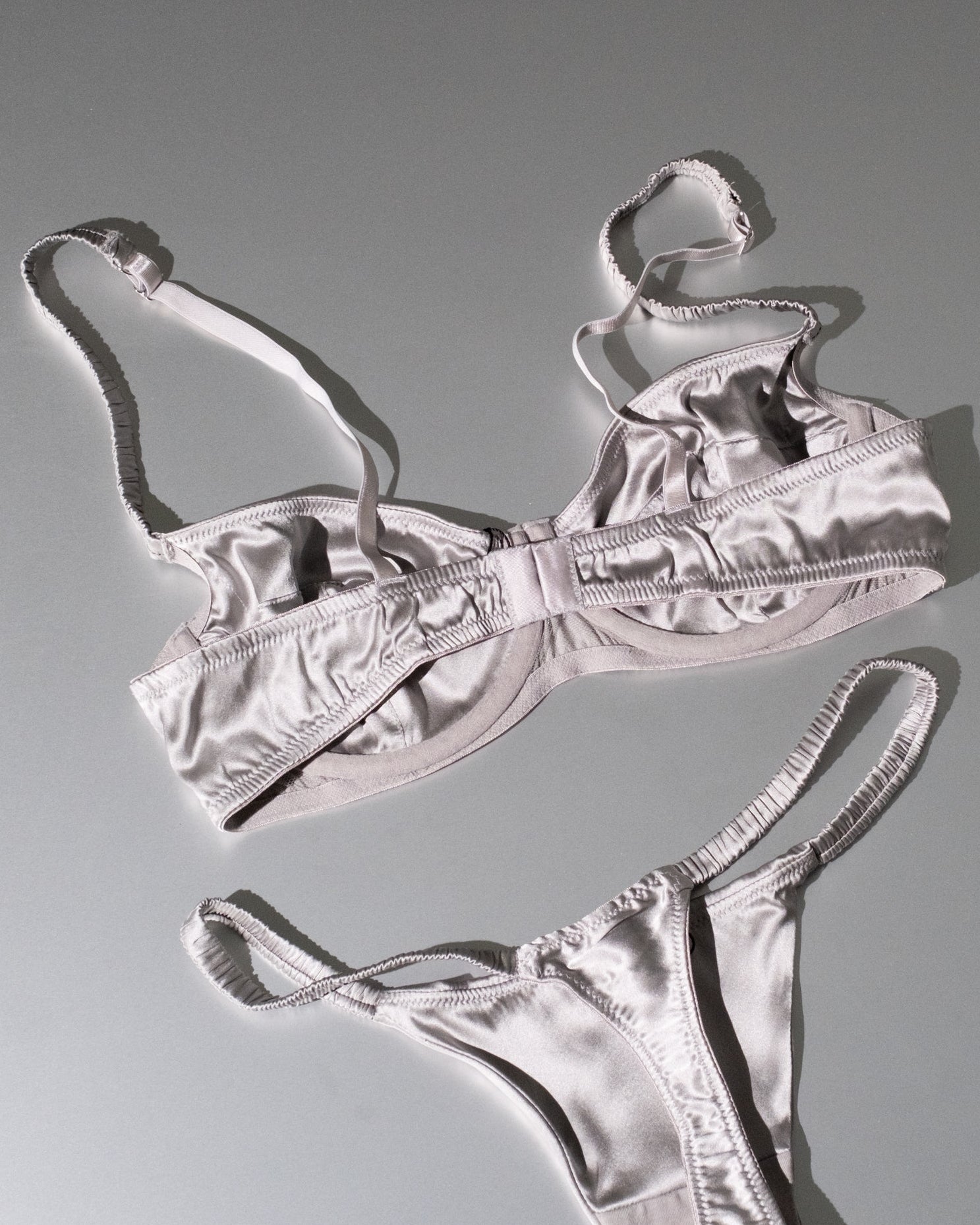 Silver bikini set on a gray background