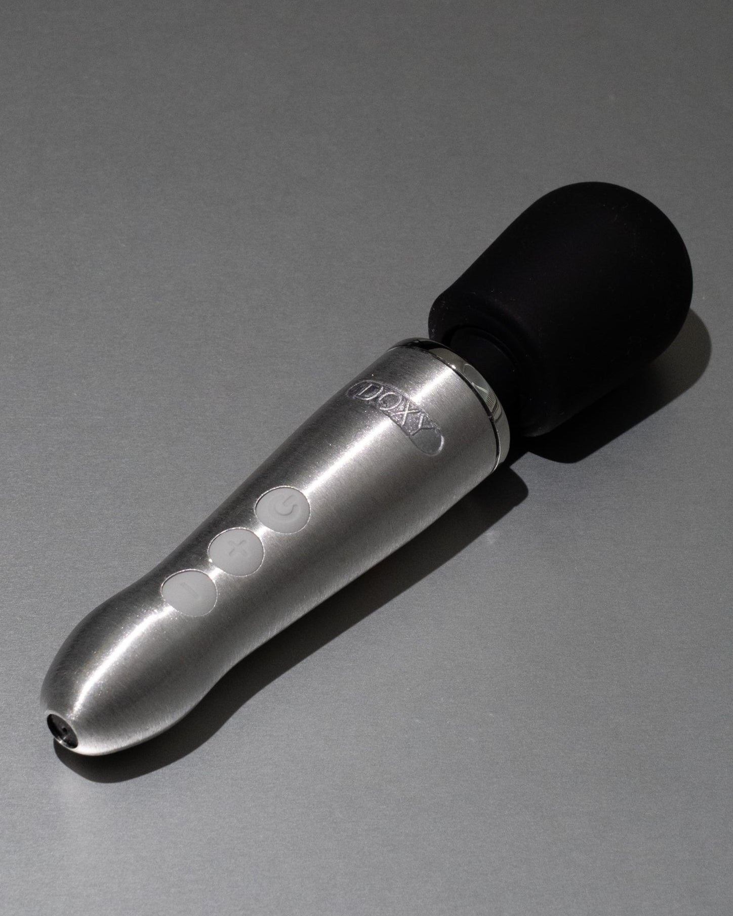 Silver and black device on a gray background