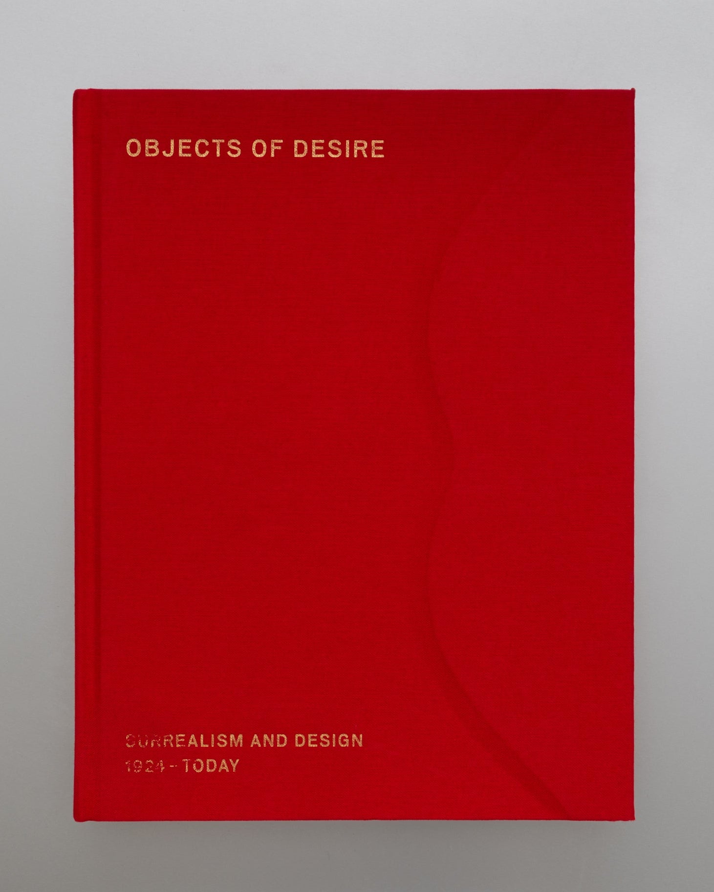 Red book titled 'Objects of Desire' on a gray background